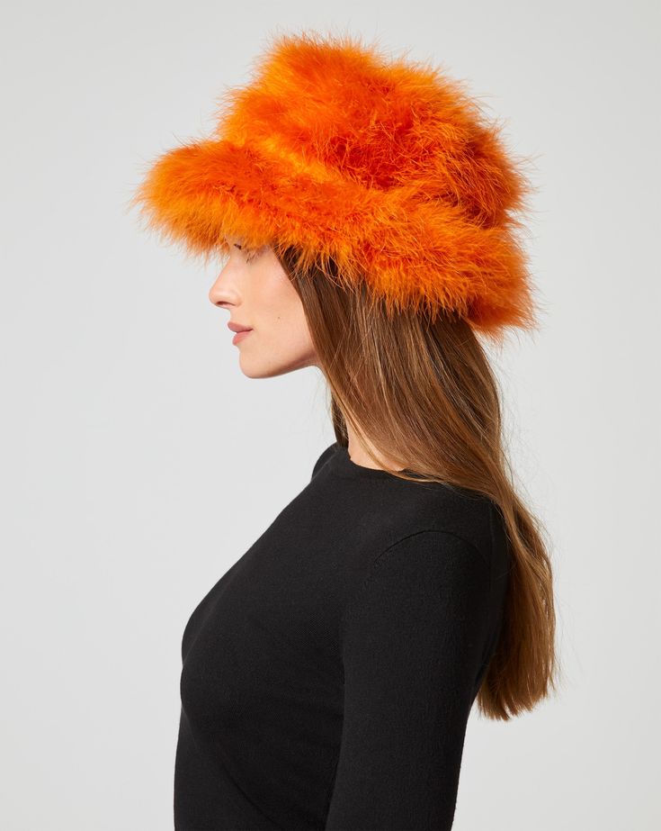 Luxurious marabou feathers find a new home in this bucket hat. Not only does it keep you warm in cooler months, it makes a stylish addition to brunch or lunch on the town. Marabou Feathers, Jumpsuit Jacket, Outerwear Vest, Fall Collections, Sweater Skirt, Skirt Pants, Jacket Tops, Vest Jacket, Feathers