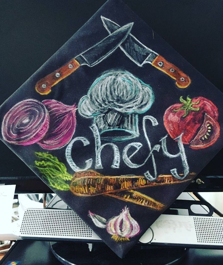 a black graduation cap with the words chef written on it and vegetables drawn on it