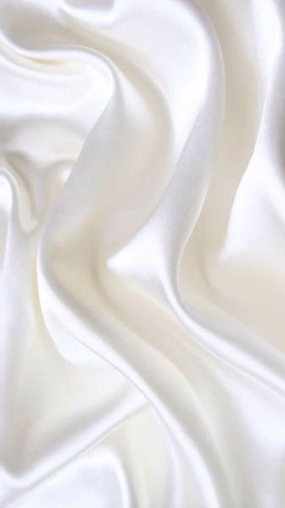 the white fabric is very soft and smooth, but it doesn't look like silk