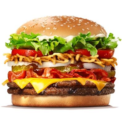 a cheeseburger with lettuce, tomato and onion on it's bun