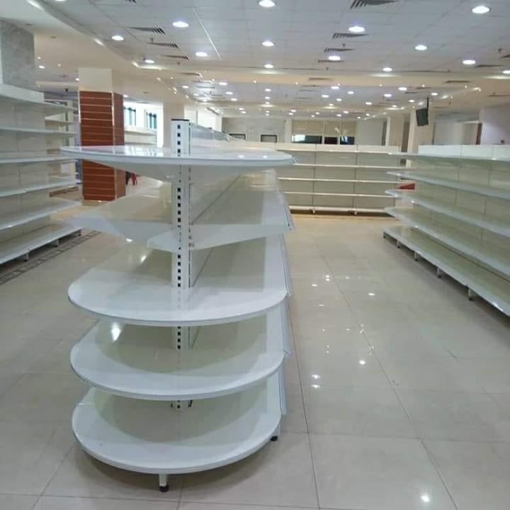 empty shelves in a large store with no people inside or on the shelf top,