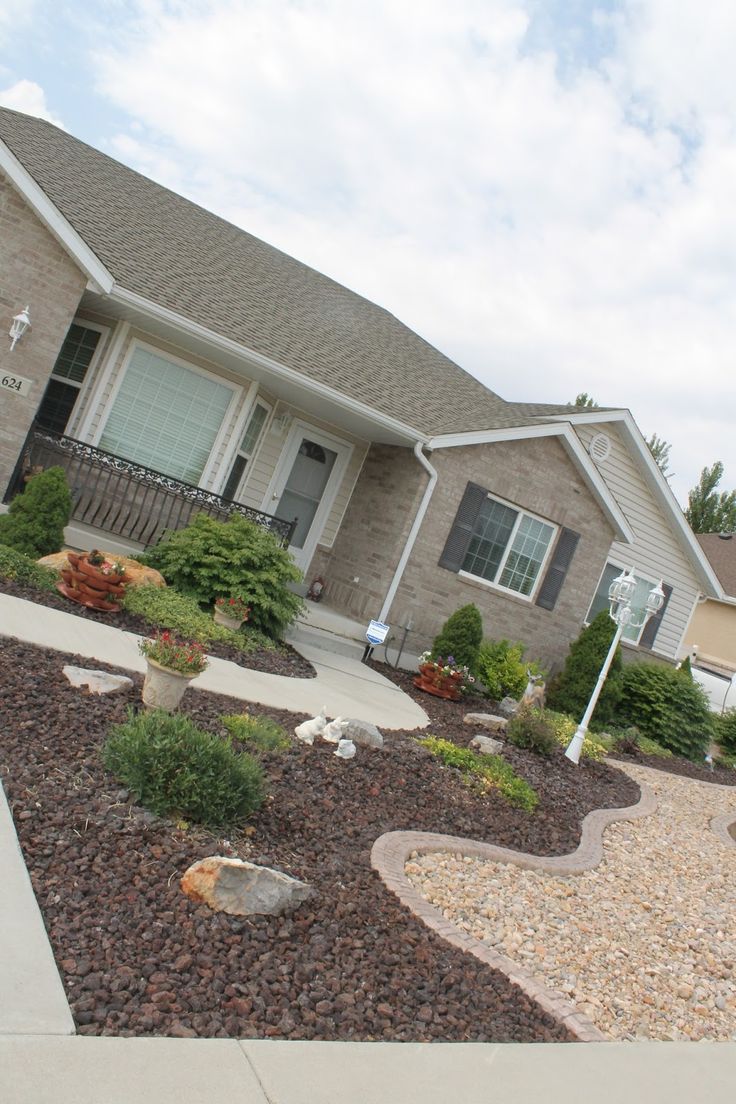 a house with landscaping in front of it