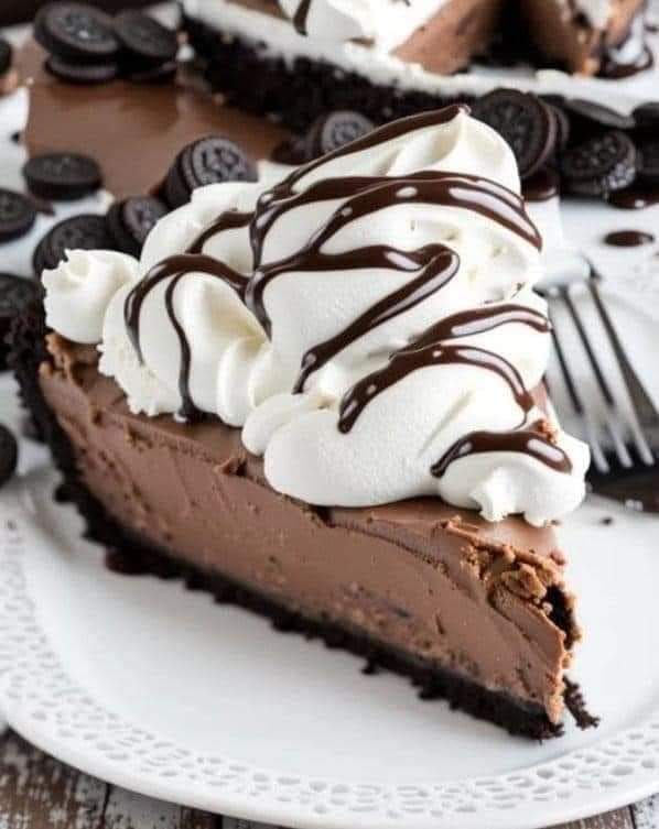 a slice of chocolate ice cream pie on a white plate