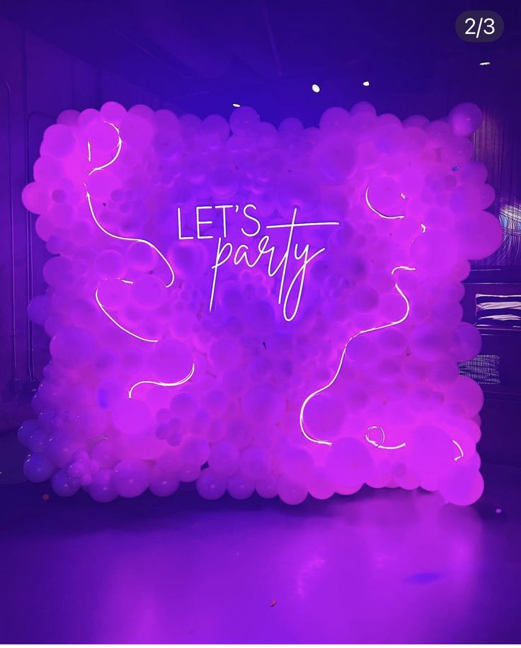 a neon sign that says let's party on it in front of a purple background