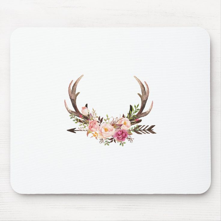 the antlers are adorned with flowers and leaves mouse pad is on a white surface