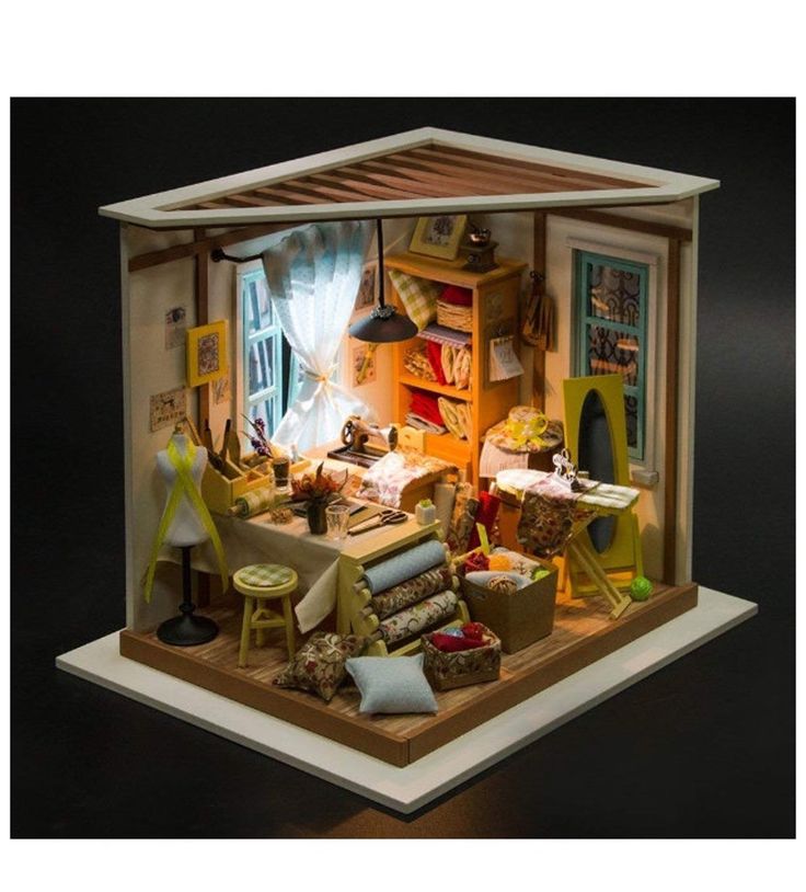 a doll house with furniture and accessories in it