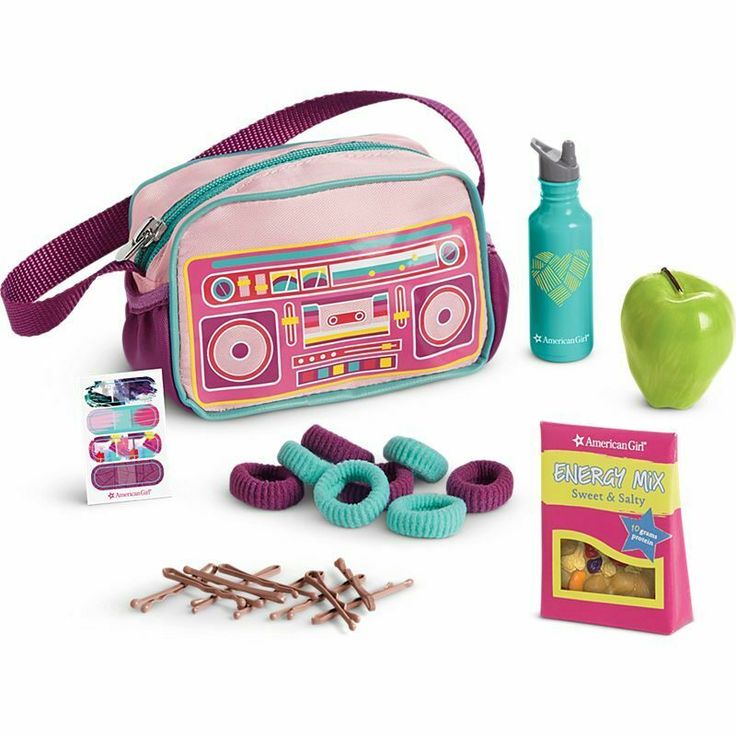 an assortment of toys including a pink bag, ear buds and other items for play