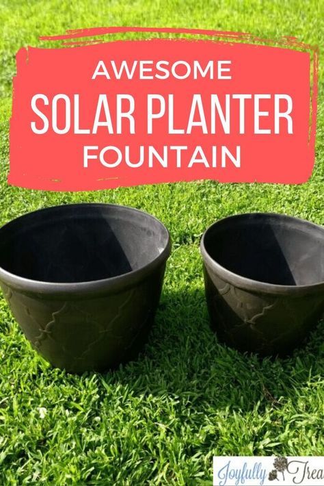 two black bowls with the words awesome solar planter fountain in front of them on green grass