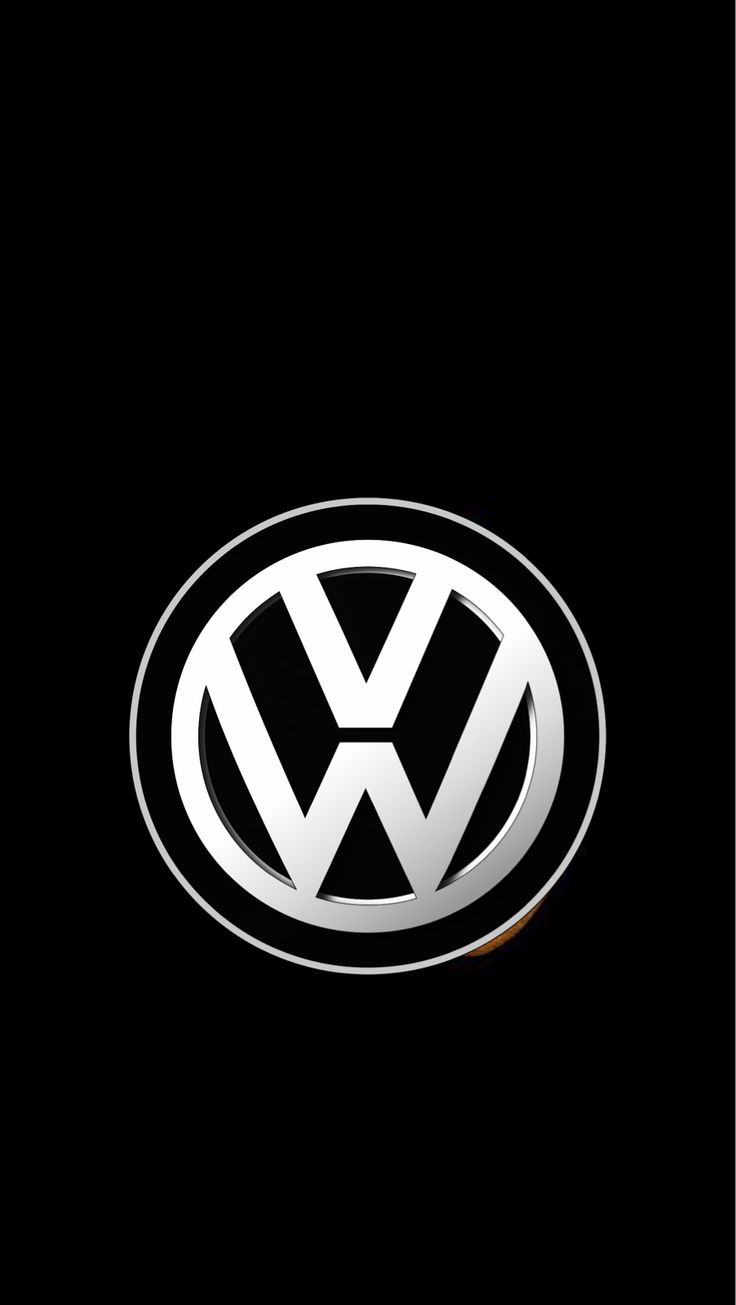 the volkswagen logo is shown on a black background