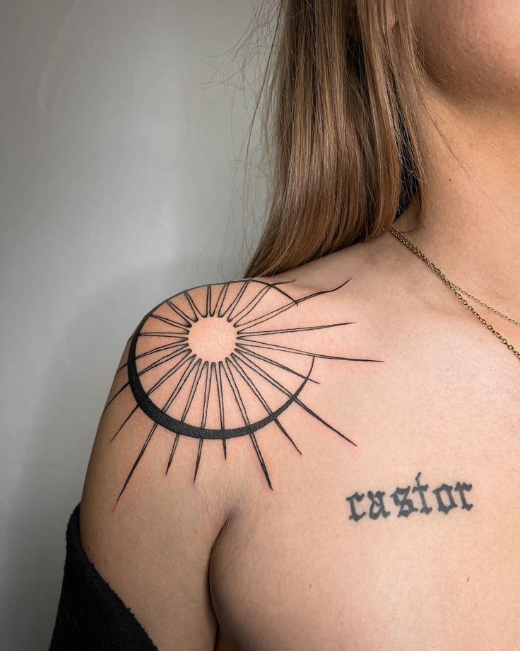 a woman with a tattoo on her shoulder and the word canon written in cursive writing