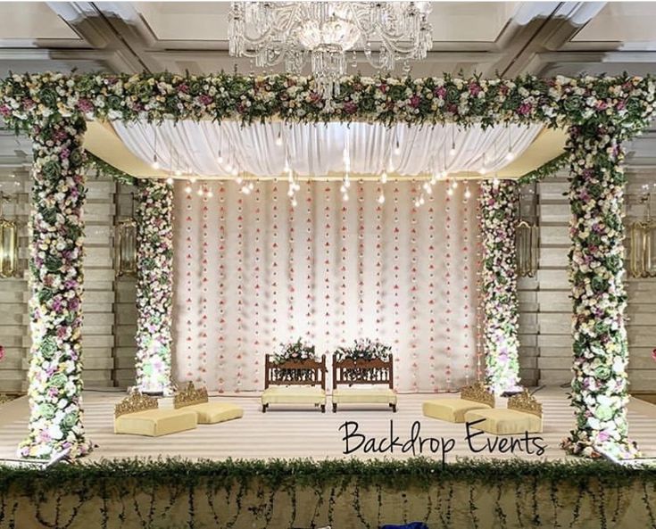 a wedding stage decorated with flowers and greenery at the back drop events in new york, ny