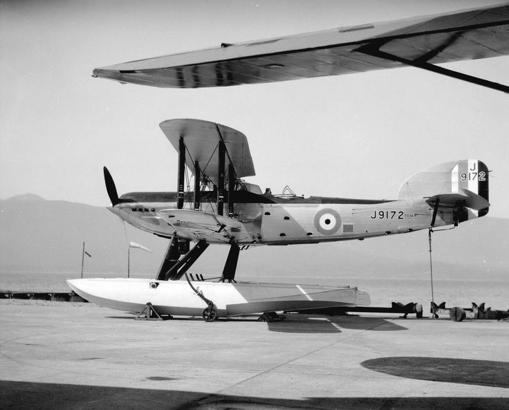 an old airplane is parked on the tarmac