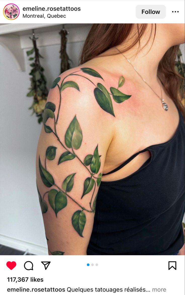 a woman with green leaves on her arm