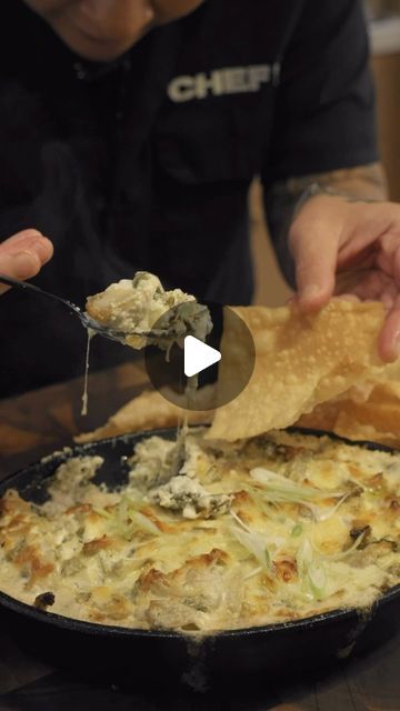 a man is dipping some food into a skillet