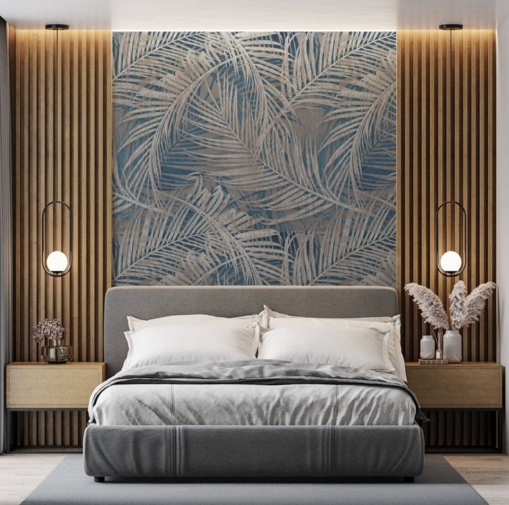 a bedroom with a bed, nightstands and paintings on the wall behind it in shades of blue