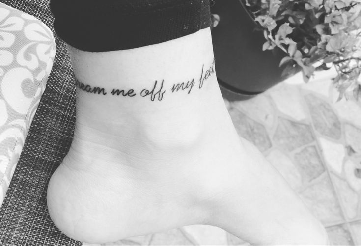 a woman's foot with a tattoo that says, you are off my feet