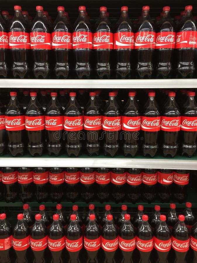 many bottles of coca - cola on shelves in a store stock images and royalty photos