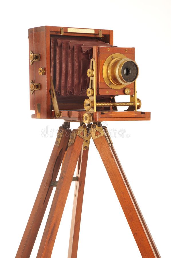 an old fashioned wooden camera on a tripod with white background stock photo - 7879