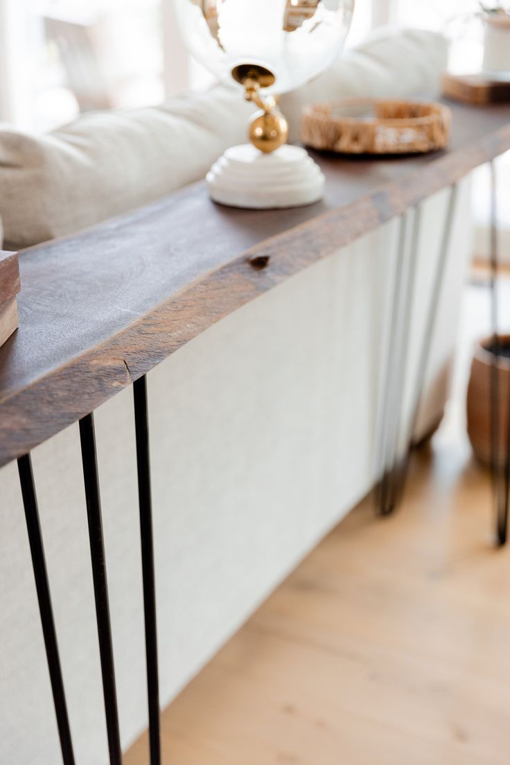 a table with some food on top of it next to a couch in a living room