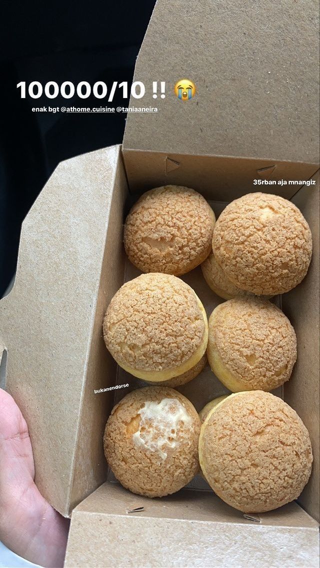 a box filled with donuts sitting on top of a table