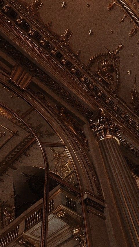 an ornately decorated ceiling in a building