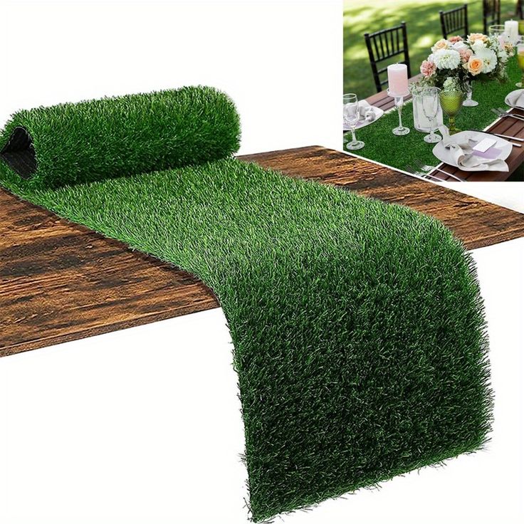 the table is set with grass runner and place setting