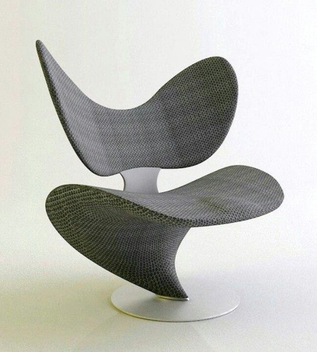 the chair is designed to look like an egg - shaped object with curved arms and legs