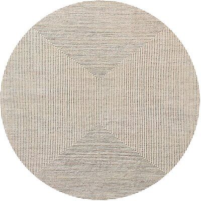 a round rug with lines in the middle on a white background, it looks like an oval