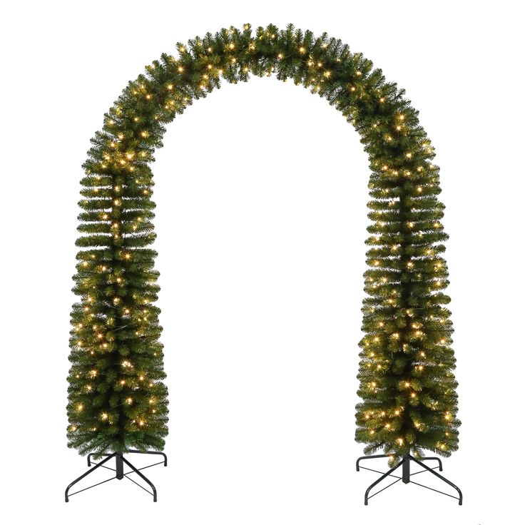 two christmas trees with lights on them are arranged in the shape of an arch against a white background