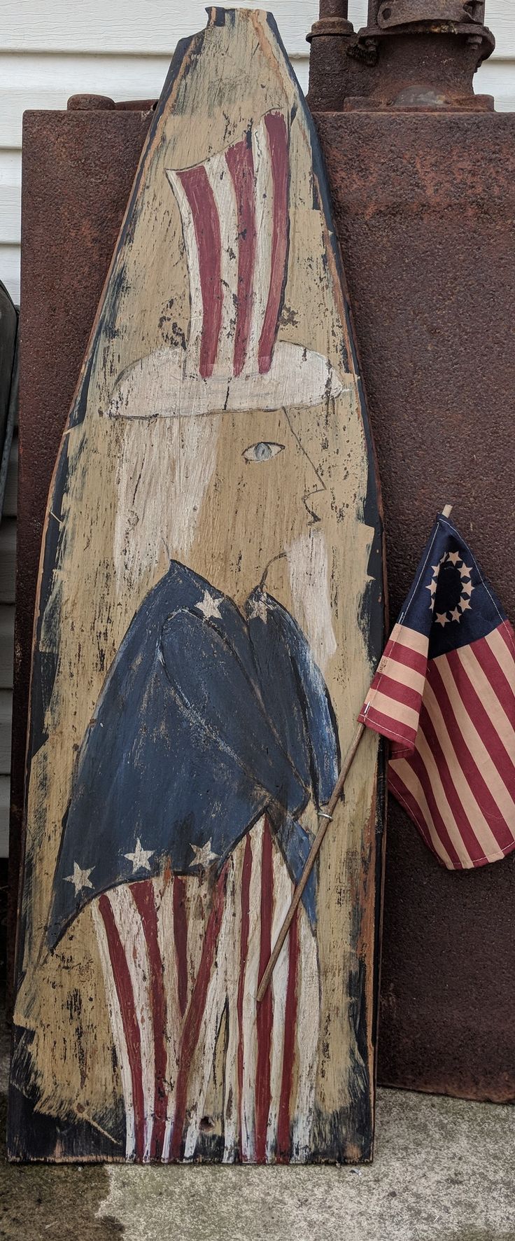 an old surfboard painted with the american flag