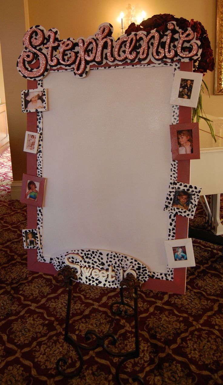 a white board with pictures on it in the middle of a room