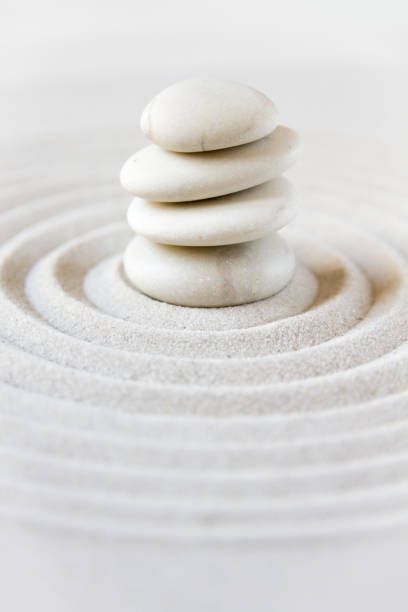 a stack of rocks sitting on top of each other in the middle of a circle