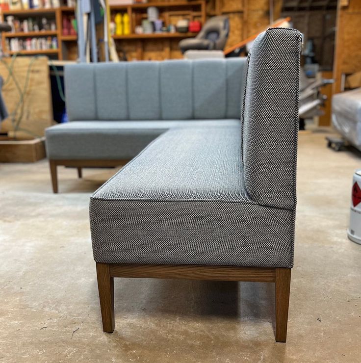 a gray couch and chair in a room