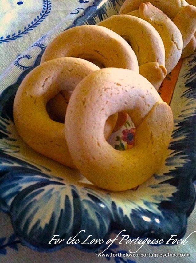 several donuts are arranged on a blue and white plate