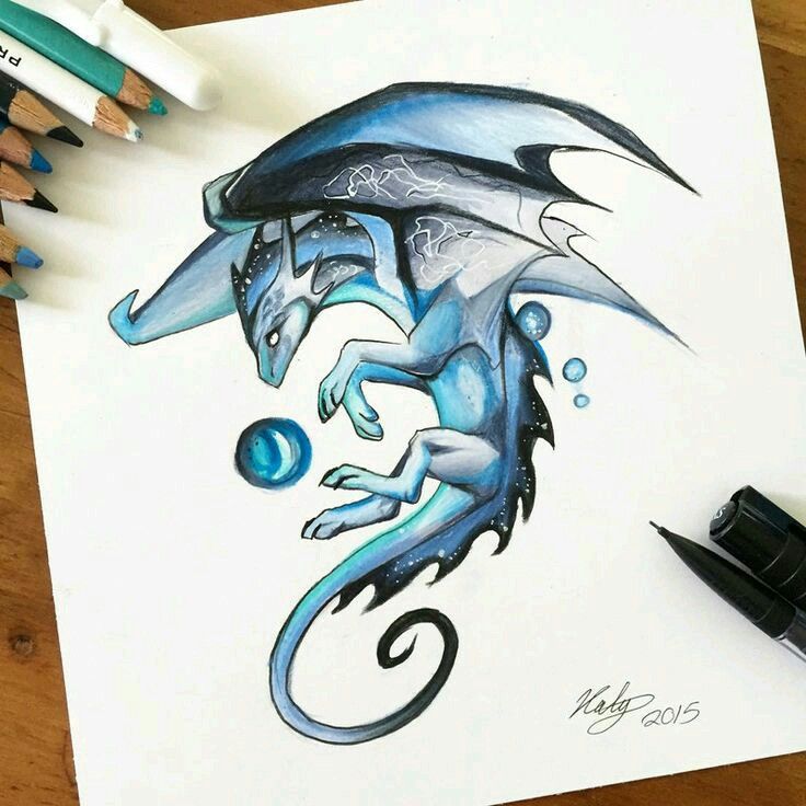 a drawing of a blue dragon on paper