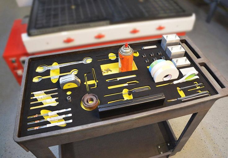 the tool tray is full of tools and other things to work with on this table