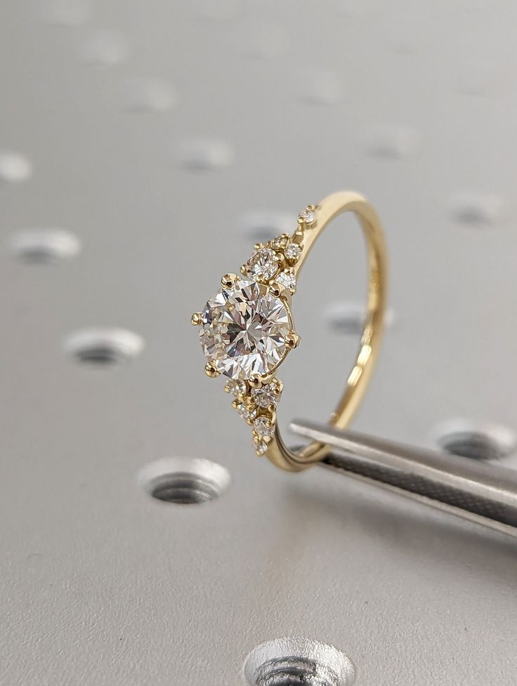 a close up of a diamond ring on a table