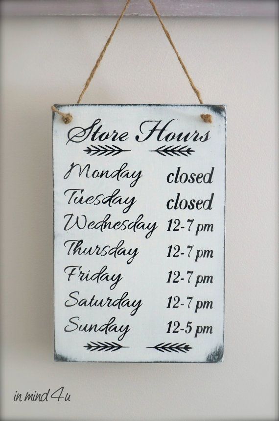 a sign hanging from the side of a wall that says there is no hours left