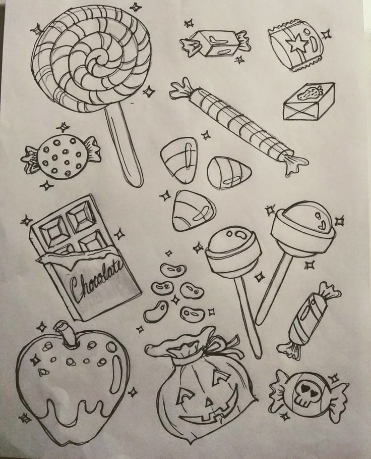 a sheet of paper that has some drawings on it, including candy and lollipops