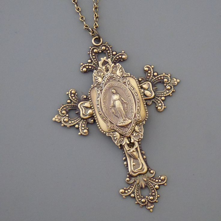 "Vintage Jewelry - Cross Necklace - Mother Mary Necklace - Catholic Necklace - Brass Necklace - Chloe's Vintage Jewelry This is such a gorgeous vintage piece. An extraordinary large layered cross.  A lovely metal of Mother Mary. Exquisite detail with a rich patina. The pendant hangs from a lovely vintage ladder chain. Chloe says, \"Wear it and feel fabulous!\" The pendant is 4\" long and 2 1/4\" wide.  You can choose the necklace length you would like at checkout. Thanks for visiting Chloe's Car Mother Mary Necklace, Large Cross Necklace, Vintage Ladder, Mary Necklace, Catholic Necklace, Cross Jewelry Necklace, Bainbridge Island, Catholic Jewelry, Jewelry Accessories Ideas