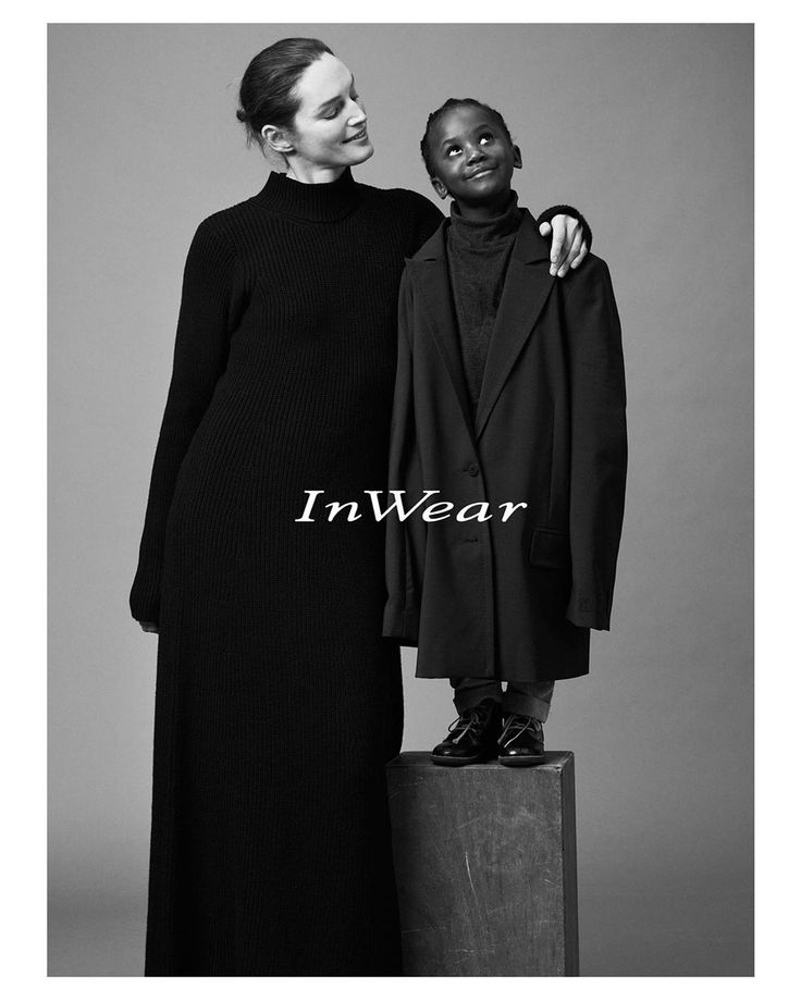 two people standing next to each other in front of a black and white photo with the words inwear on it