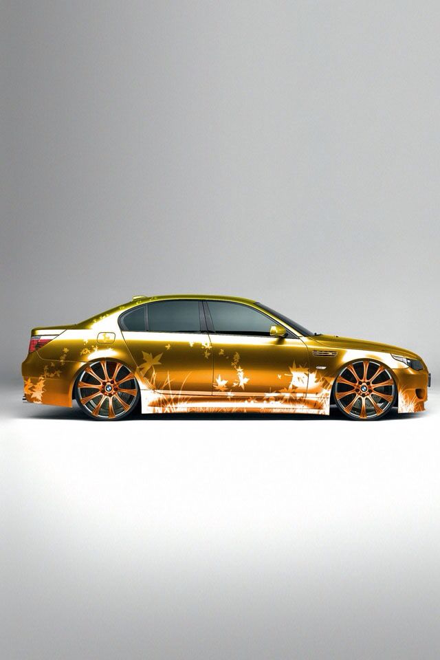 a gold car is shown in this artistic photo, it appears to be painted with orange paint