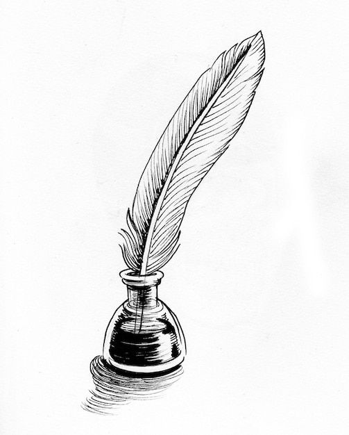 a pen with a feather resting on top of it