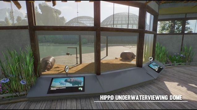 an animal exhibit with two hippos in the background