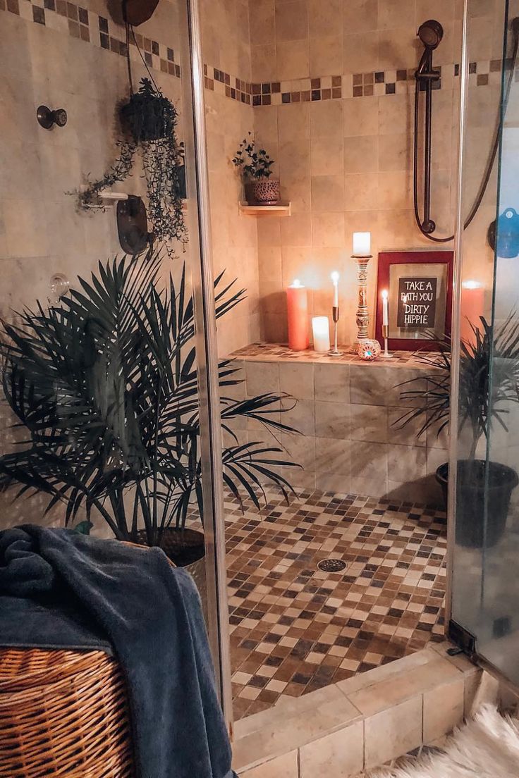 a bath room with a walk in shower next to a sink