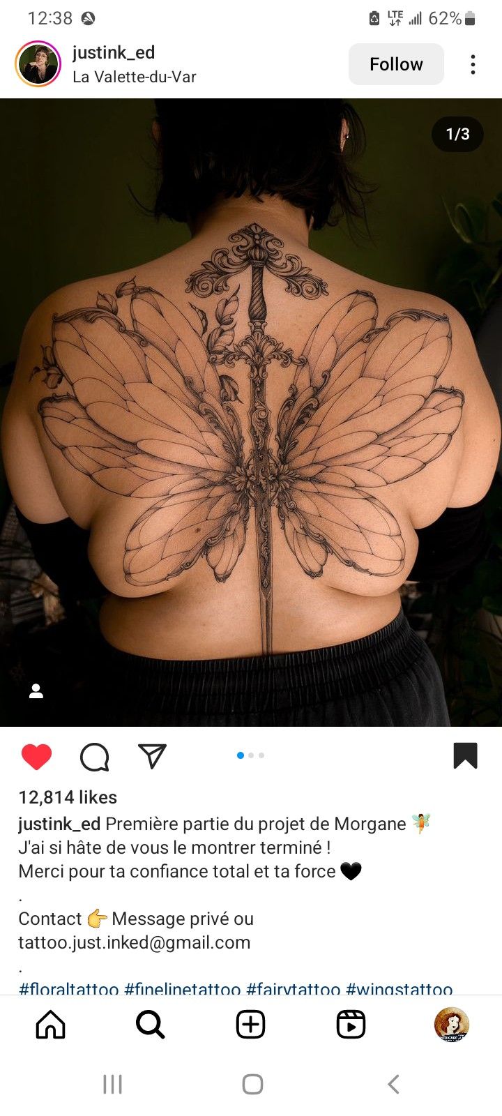 the back of a woman's body with tattoos on it