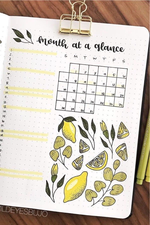 a planner with lemons on it and the month at a glance written in black ink