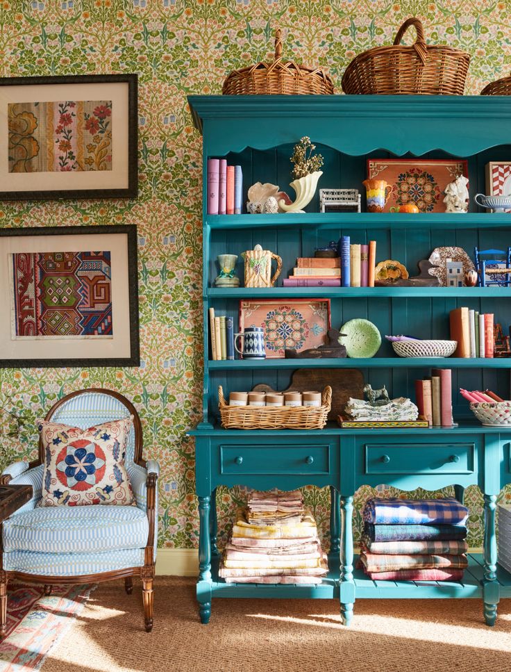 a blue bookcase with many books on it