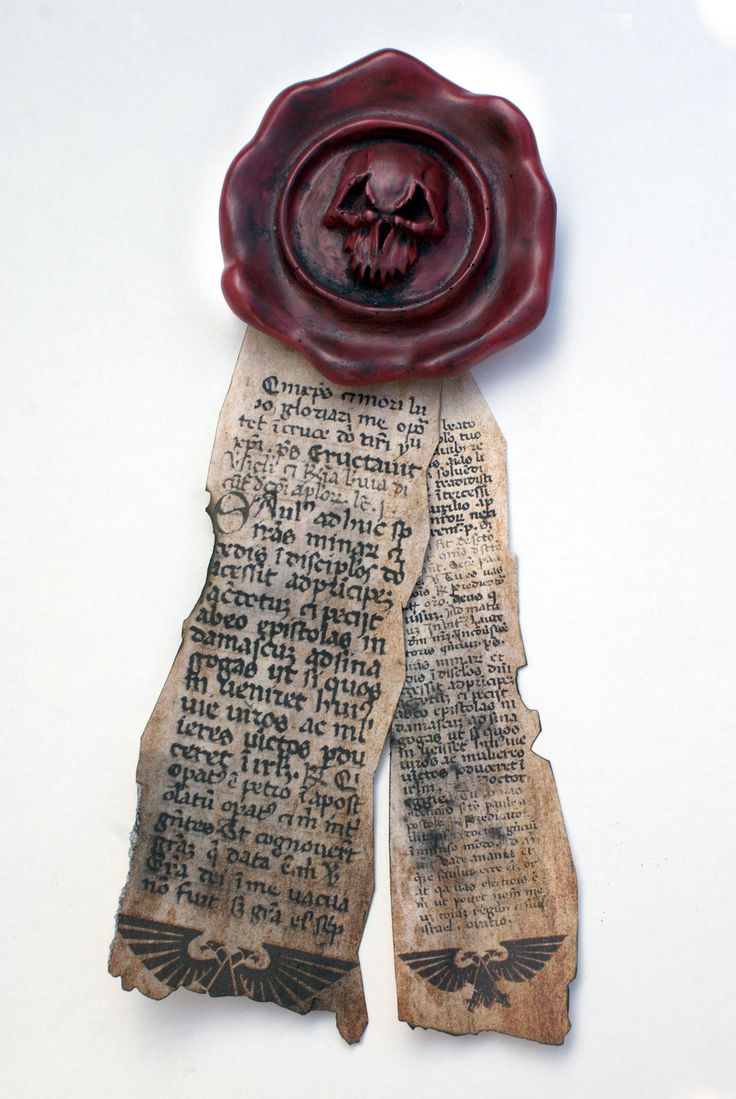 a piece of paper that has been altered to look like a wax seal with a skull on it