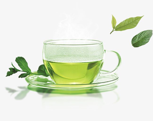 a glass cup filled with green tea sitting on top of a saucer next to leaves